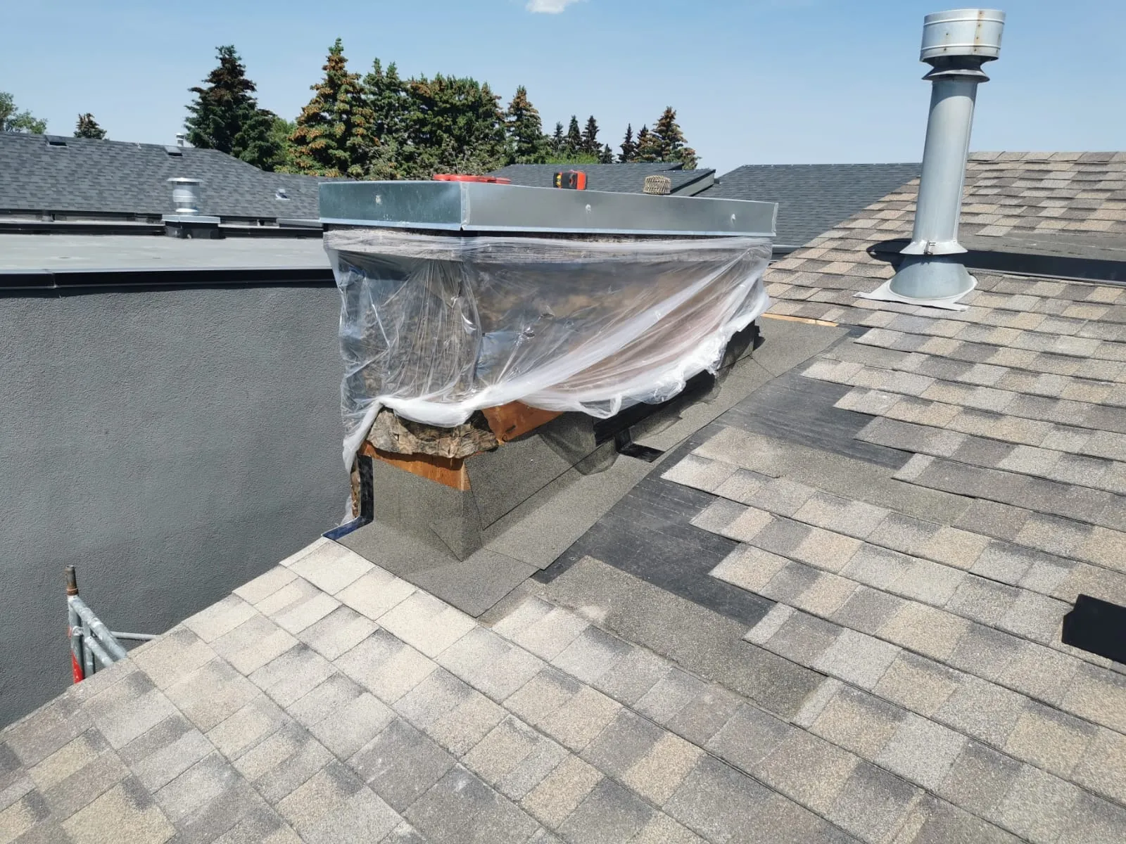 A section of field shingles replaced mid-slope