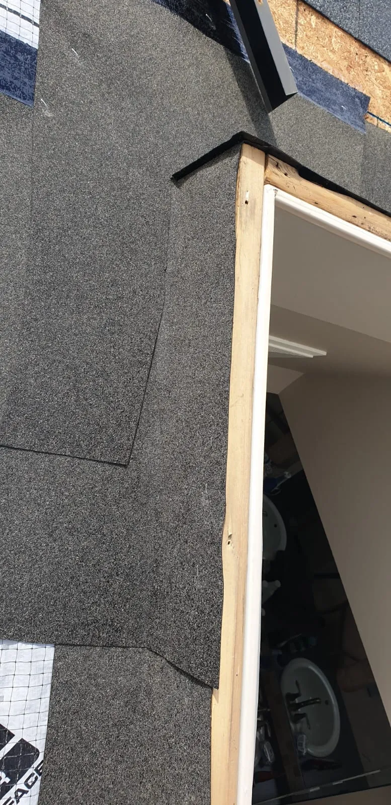 Skylight curb framed and sealed with ice and water membrane