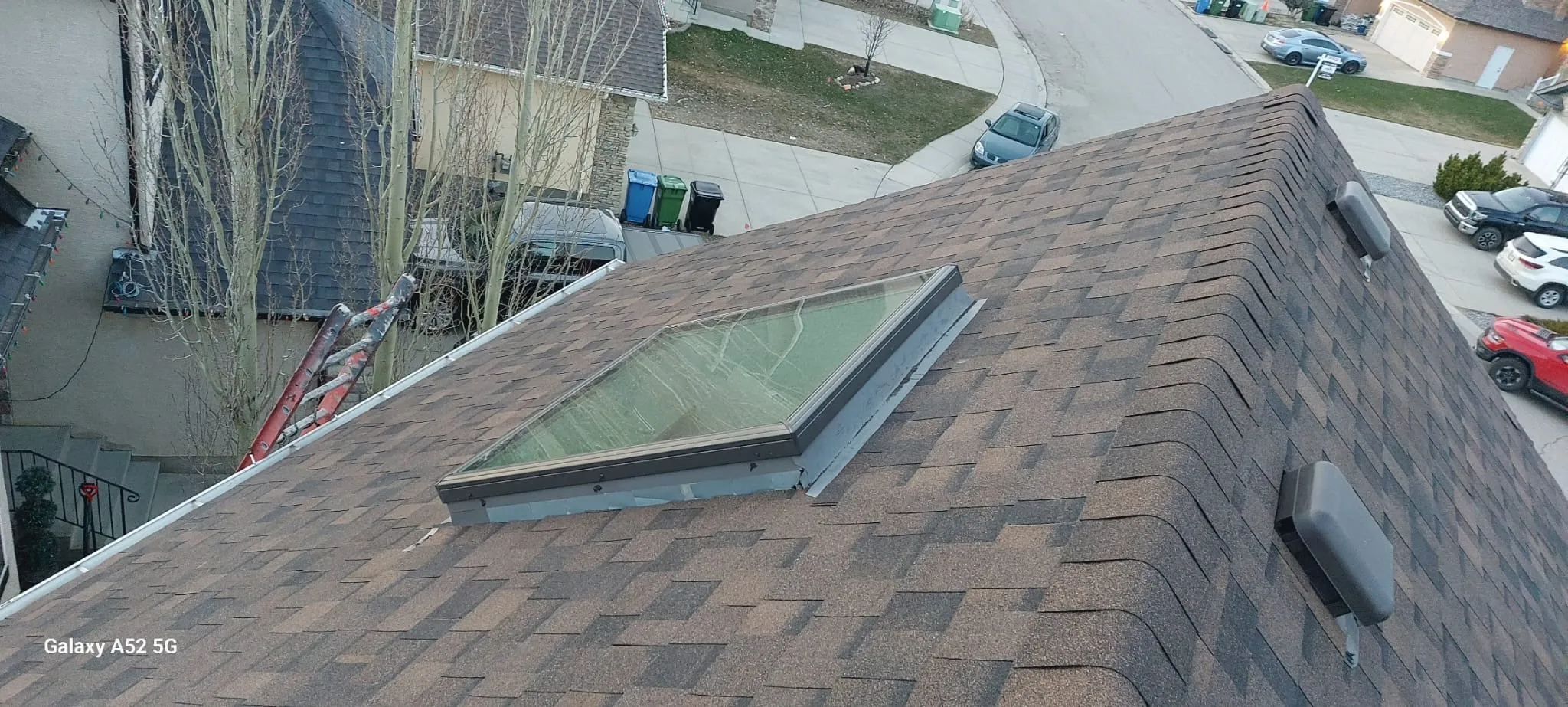 Skylights set into a shingle roof, seen from above