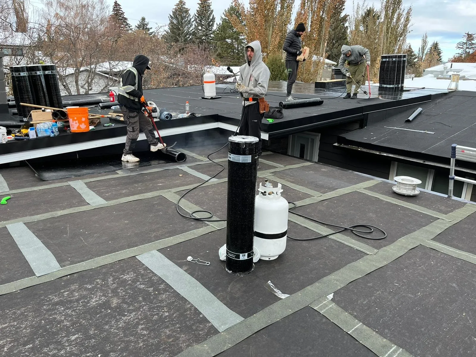 SBS torch-down membrane being installed on a flat roof