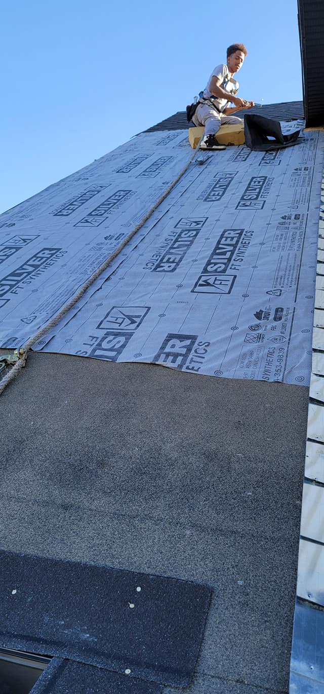 Professional roofer at work in Calgary